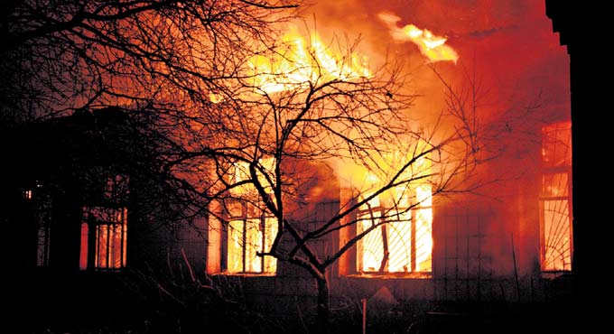 Why does glass break during fire?