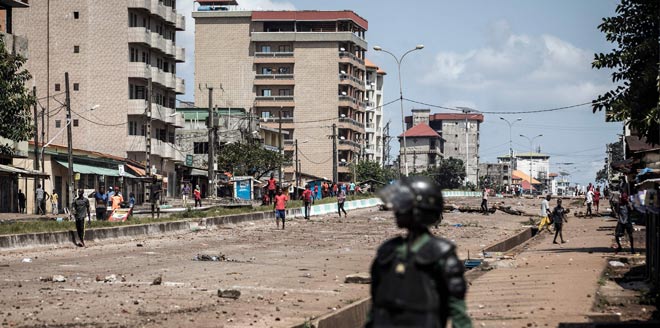 At least 21 dead in Guinea unrest as envoys try to mediate