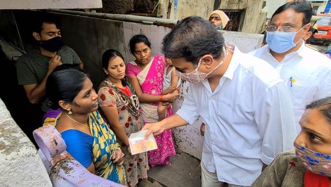 Watch: KTR gives financial assistance at door-step of rain-affected in Hyderabad