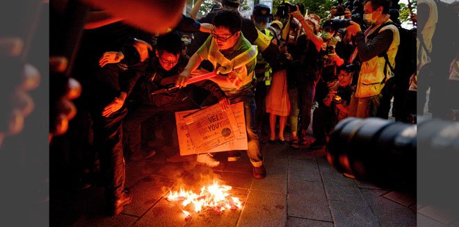 Hundreds march in Taiwan to support 12 arrested Hong Kongers