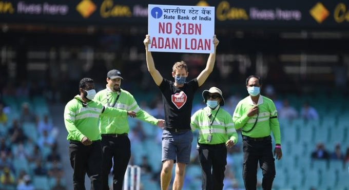 1st ODI: Protesters barge into SCG holding ‘No $1B Adani Loan’ signs