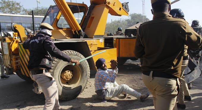Braving water canons, clashing with cops, farmers enter Delhi from Tikri