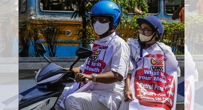 Mamata Banerjee rides pillion on electric scooter to protest fuel price hike