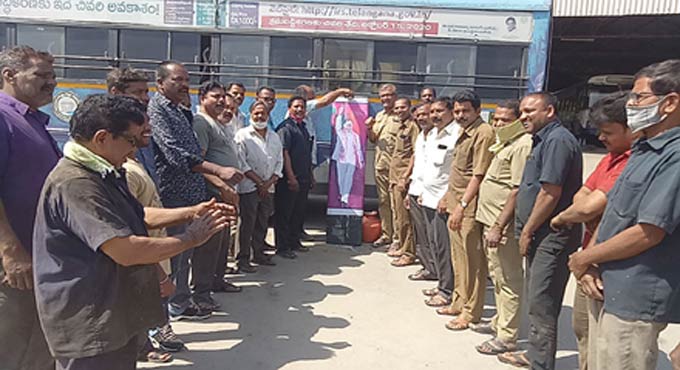 TSRTC staff perform milk bath to KCR’s portrait in Nalgonda