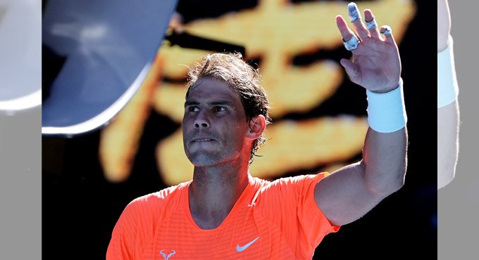Rafael Nadal shrugs off back pain, cruises to easy win