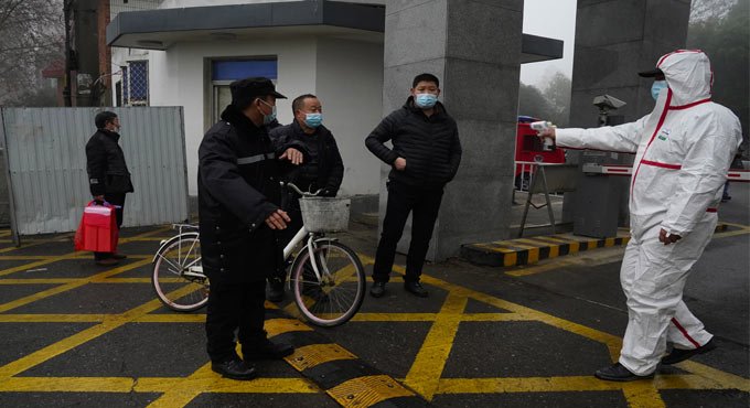 WHO team in Wuhan visits provincial disease control center