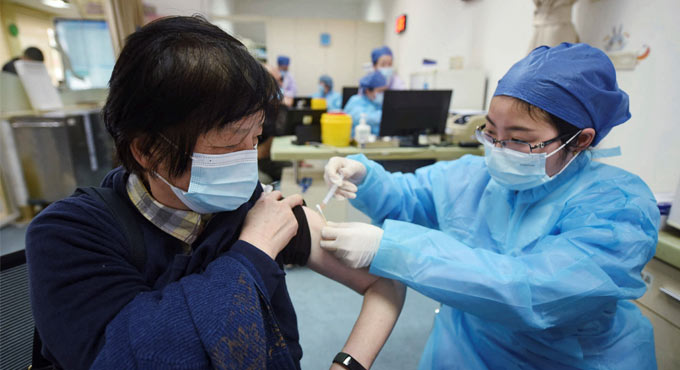 China has administered 65 million vaccine doses at home
