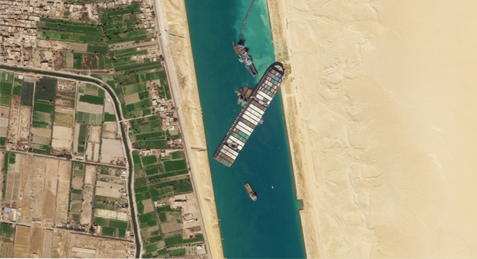Container ship stuck in Suez Canal ‘partially refloated’