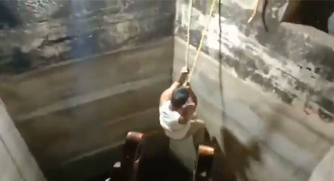 Cop goes into well to retrieve body of suicide victim in Vikarabad
