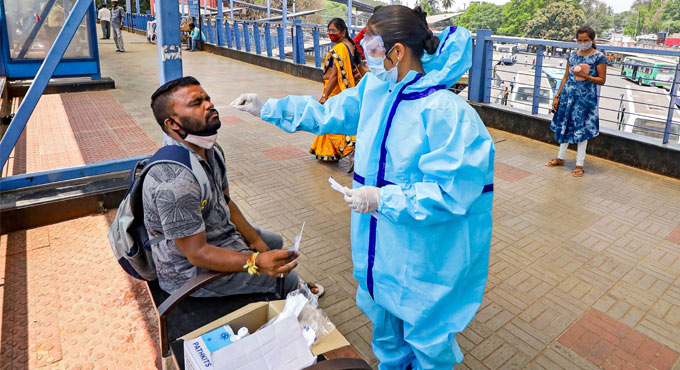 India reports 53,480 new COVID-19 infections, 354 deaths