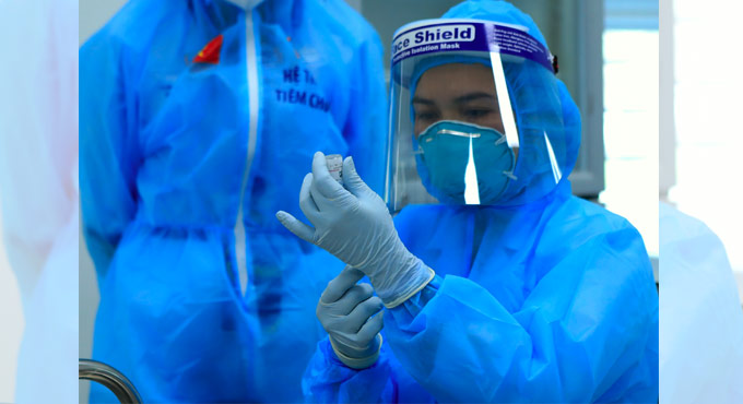 Vietnam vaccinates COVID-19 front-liners with its 1st doses