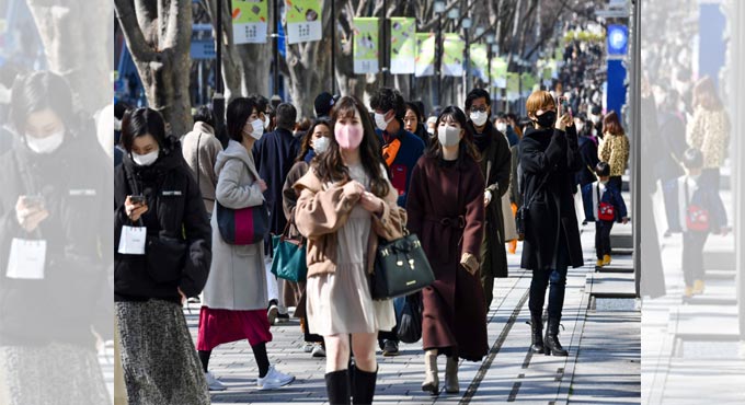 Japan expands virus alert in Tokyo area as surge spreads