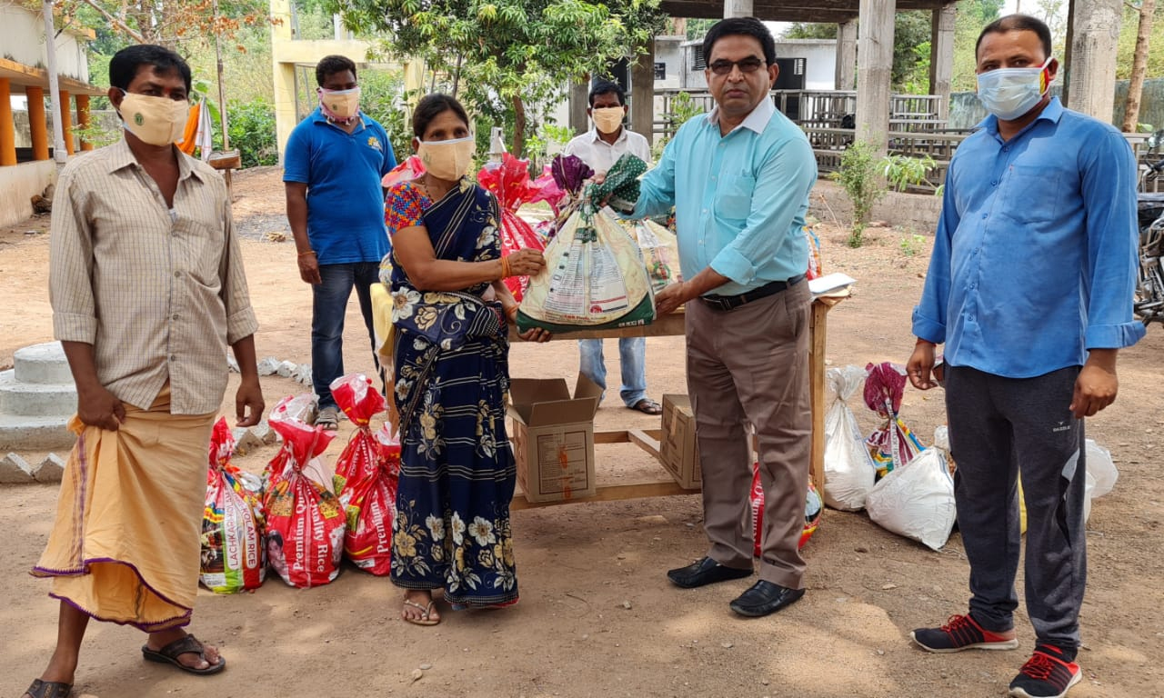CREDAI VP Madhusudan Reddy distributes groceries to tribals in Adilabad