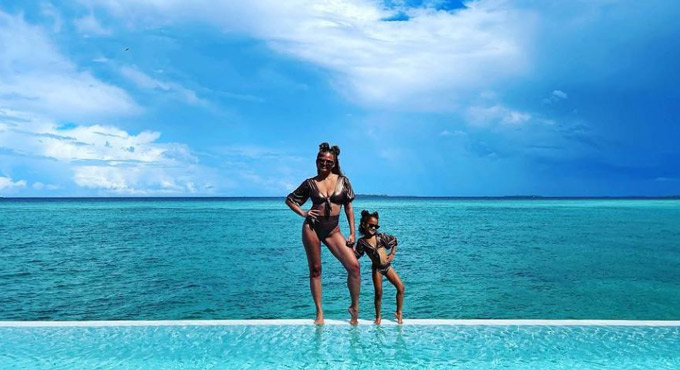Chrissy Teigen, daughter Luna twin in black bikinis