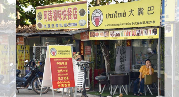 Laos locks down capital over virus outbreak tied to Thailand