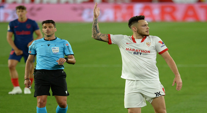 Atletico lose to leave La Liga title race open