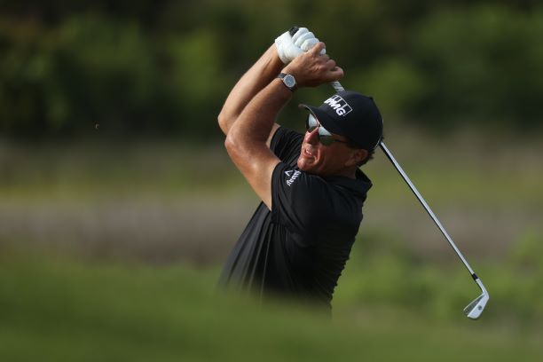 Phil Mickelson holds on to lead