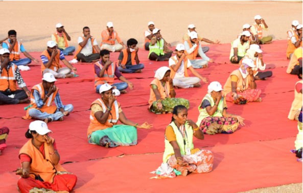 Yoga classes for sanitation workers in Karimnagar