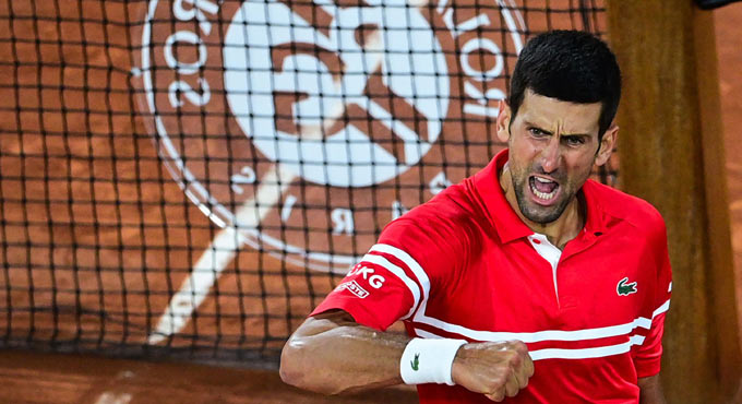 Djokovic overcomes Berrettini to set up semis clash with Nadal