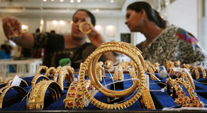 Gold declines Rs 388, silver tumbles Rs 920