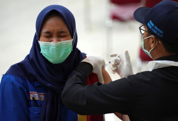 WHO warns of fresh Indonesia surge fed by virus variants