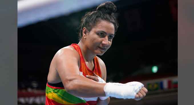 Boxer Pooja punches her way to quarters