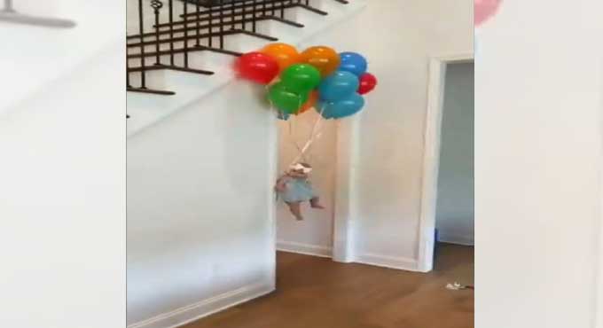 Watch: Hilarious video of baby flying with the help of helium balloons