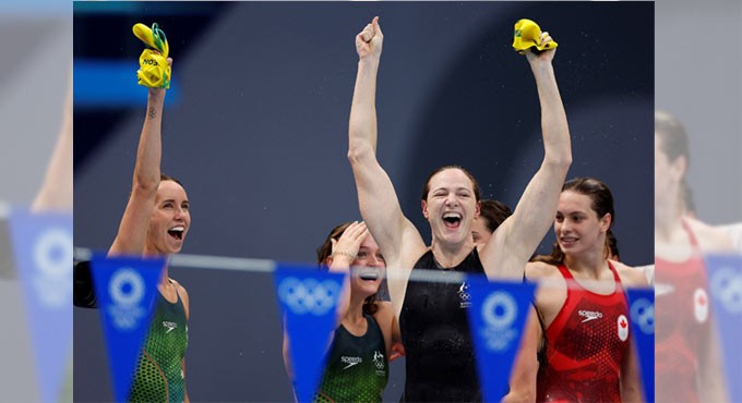 Olympic swim stars enter quarantine on return to Australia