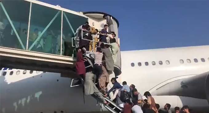 Watch: Chaos as people running around in Kabul airport to board flights