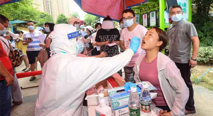 China orders mass testing in Wuhan as Covid outbreak spreads