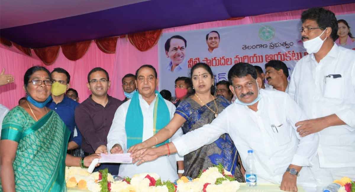 Minister Indrakaran Reddy hands over compensation to land evacuees