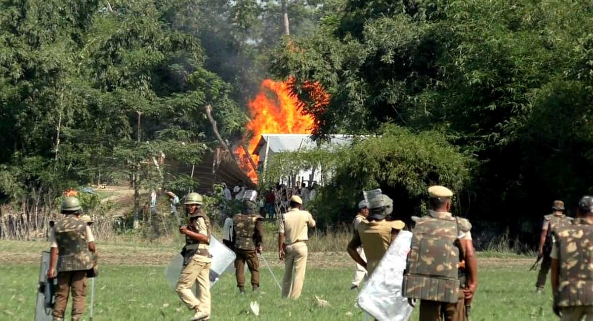 Two killed in police firing on Assam “encroachers”, video shows official photographer hitting dead man
