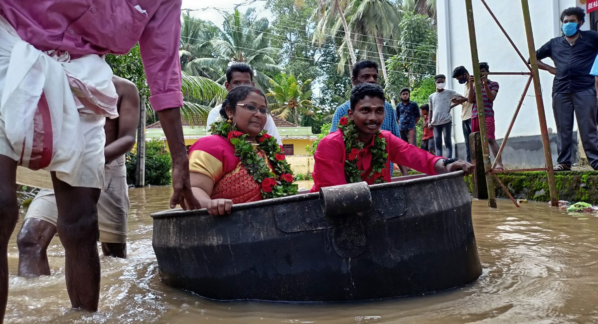 Kerala bride, groom reach flooded hall in cooking vessel, get married