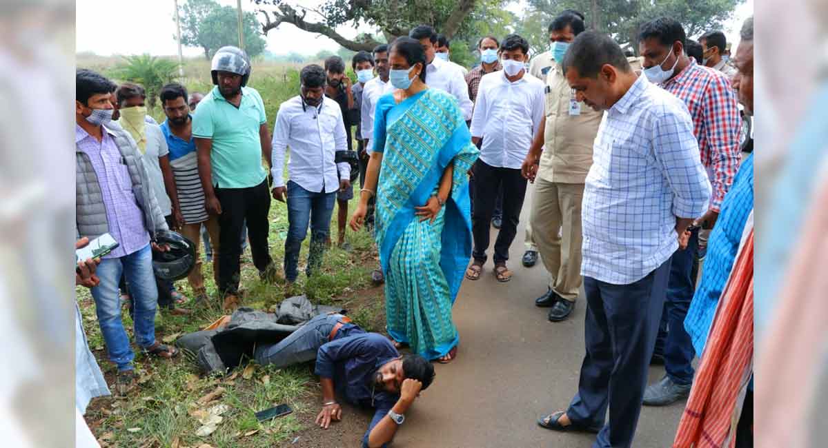 Education minister Sabitha Indra Reddy helps accident victim