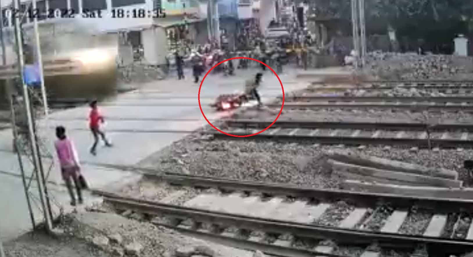 Watch: Biker narrowly escapes being hit by speeding train, leaves netizens shocked