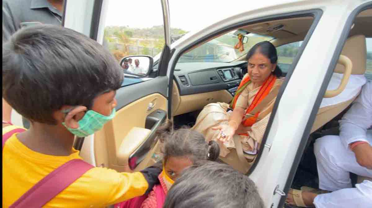 Sabitha arranges footwear to students walking barefoot