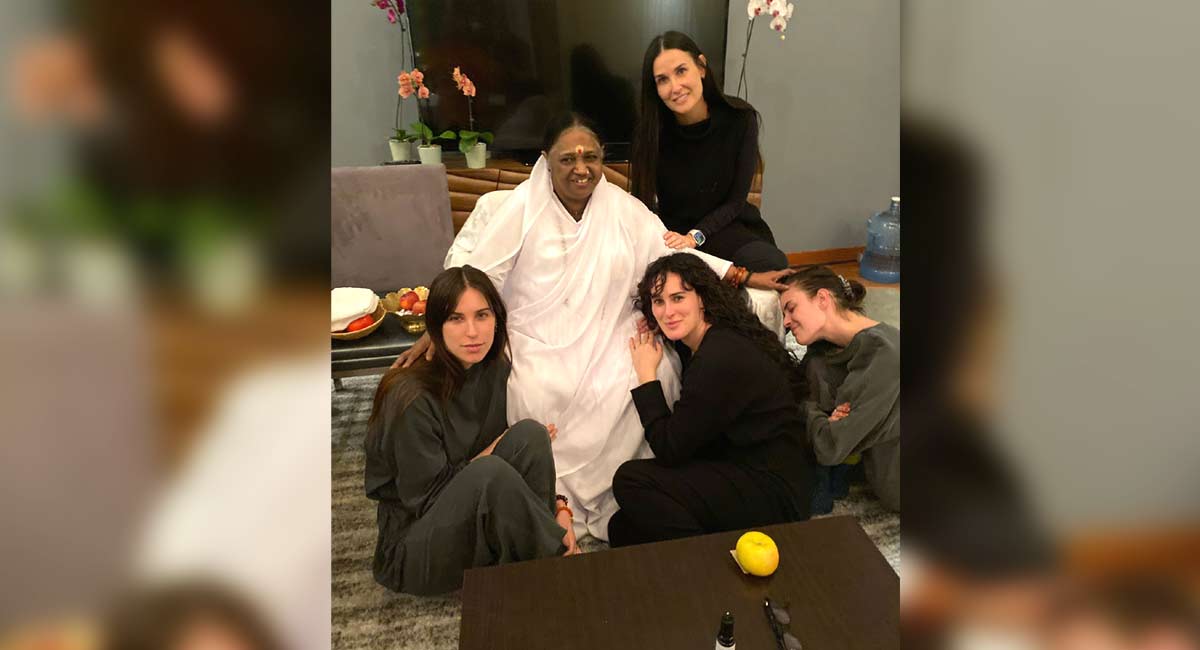 Demi Moore, daughters pose with spiritual figure Mata Amritanandamayi