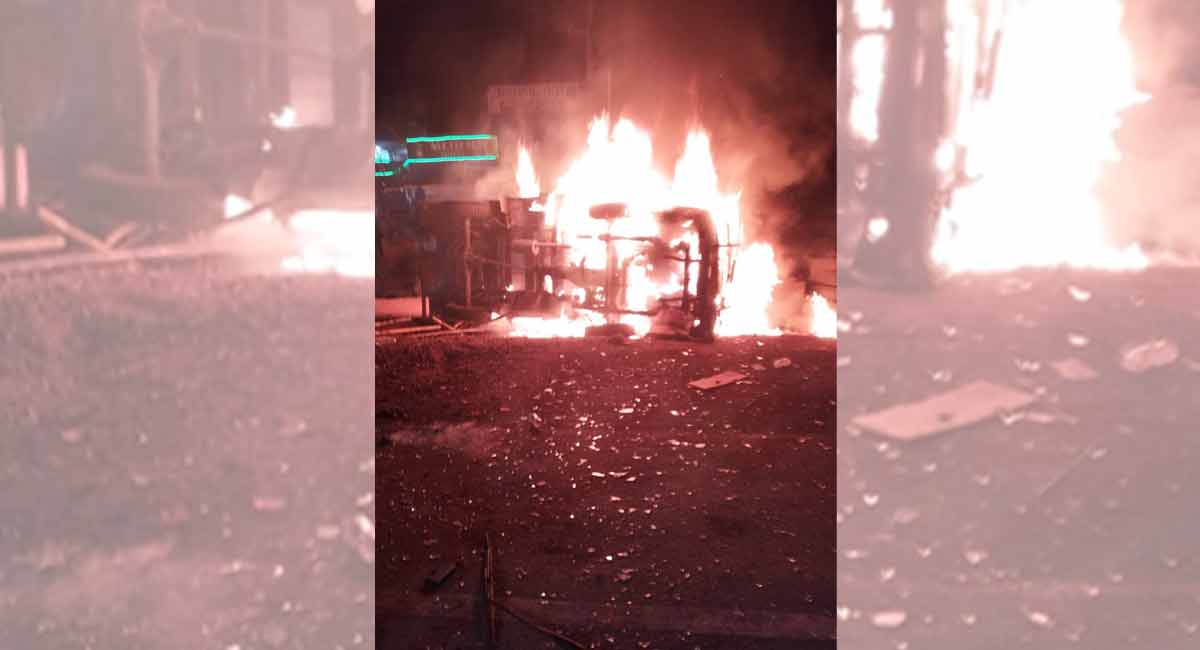 Mini goods vehicle, private bus catch fire after collision in Sangareddy, one dead