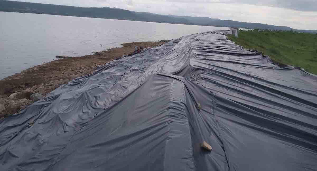 Asifabad: Authorities draw flak for using polythene covers to protect irrigation project