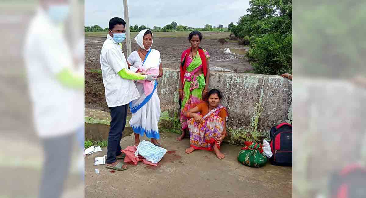 Tribal woman delivers baby on road in Asifabad