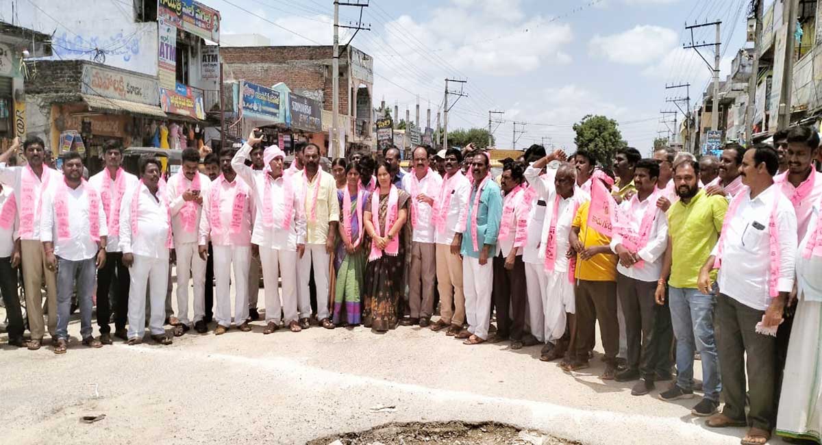 TRS workers stage protest against GST on milk products in Nalgonda