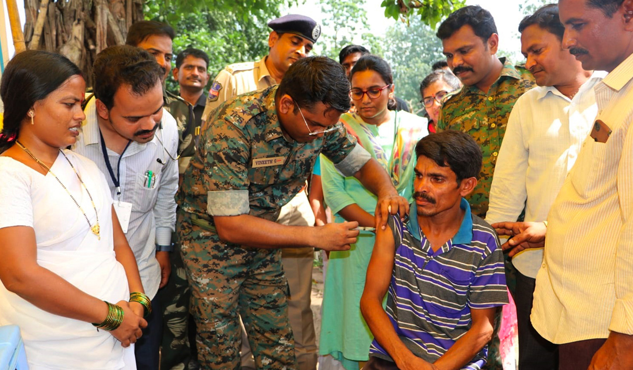 SP dons role of doctor, administers Covid vaccine to Adivasis in Kothagudem