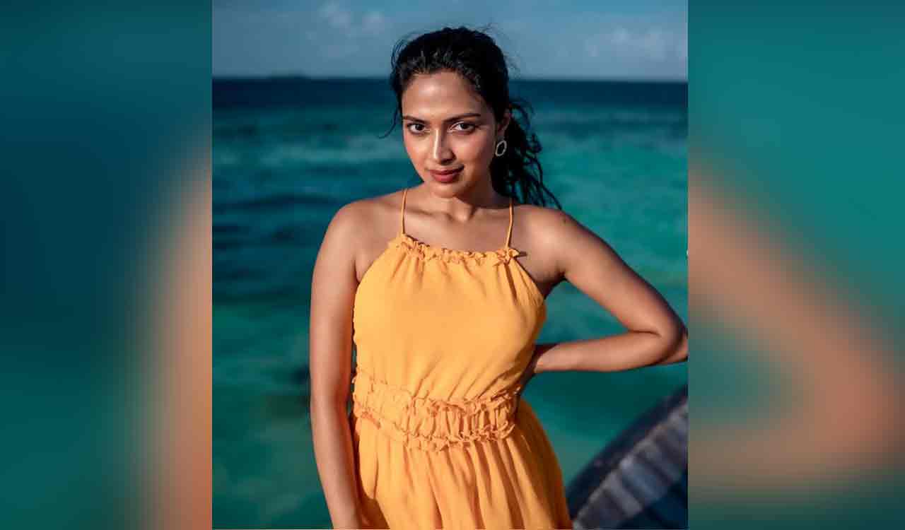 First look poster of Amala Paul and Neeraj Madhav starrer ‘Dvija’ out