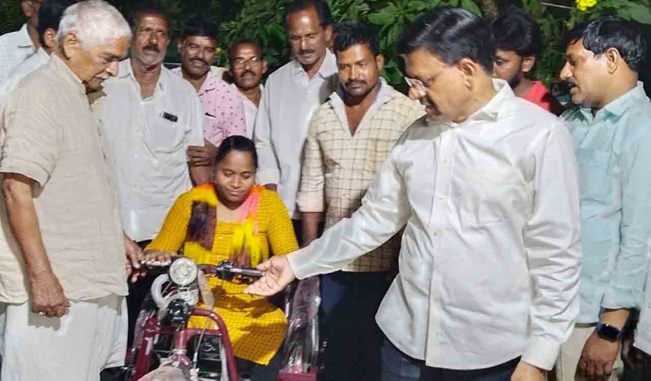 MLC Madhusudan donates tricycle to a girl in Khammam