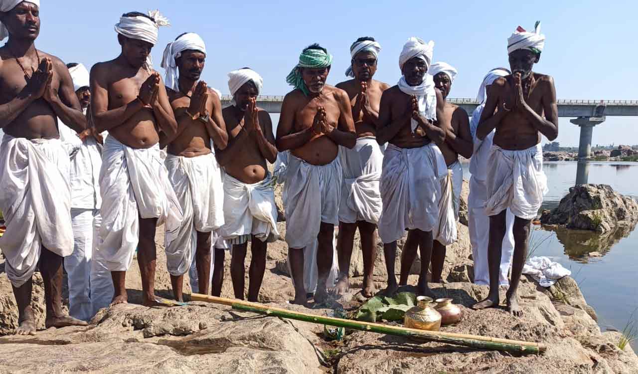 Mesrams gather water from Godavari in Mancherial