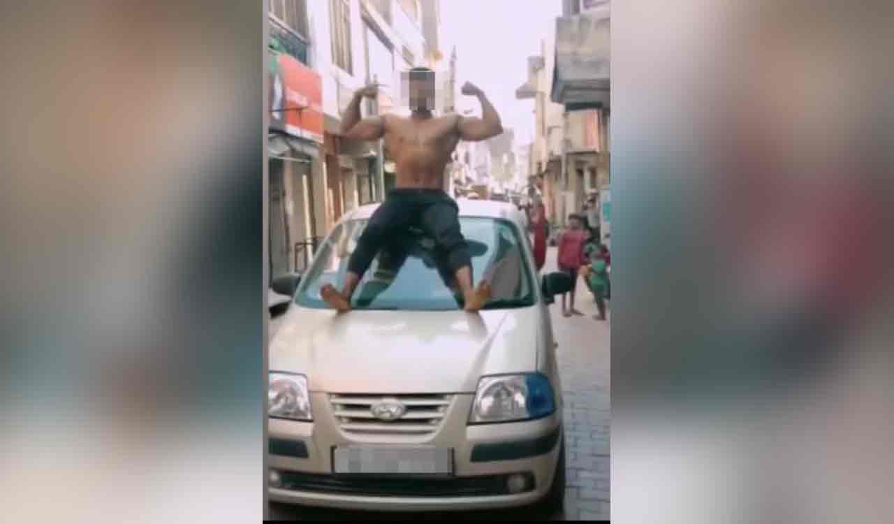Youth held for going shirtless and doing stunts on car, vehicle seized