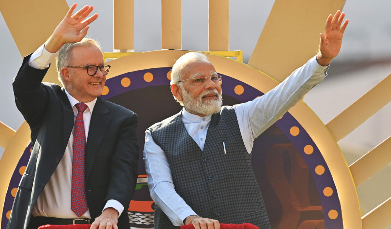Is Modi turning to cricket diplomacy to bat for Adani ?
