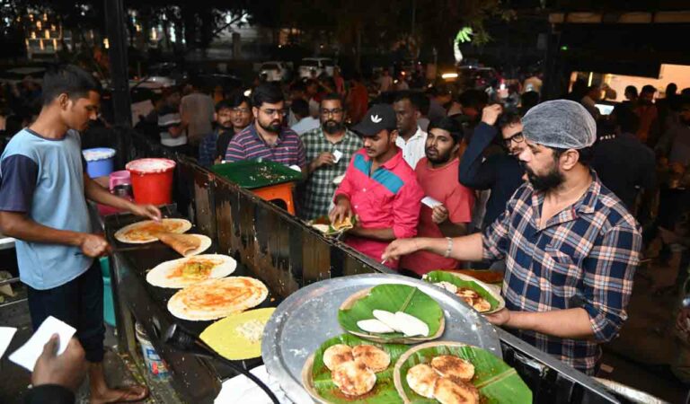 People waiting to get their food at DLF food stalls