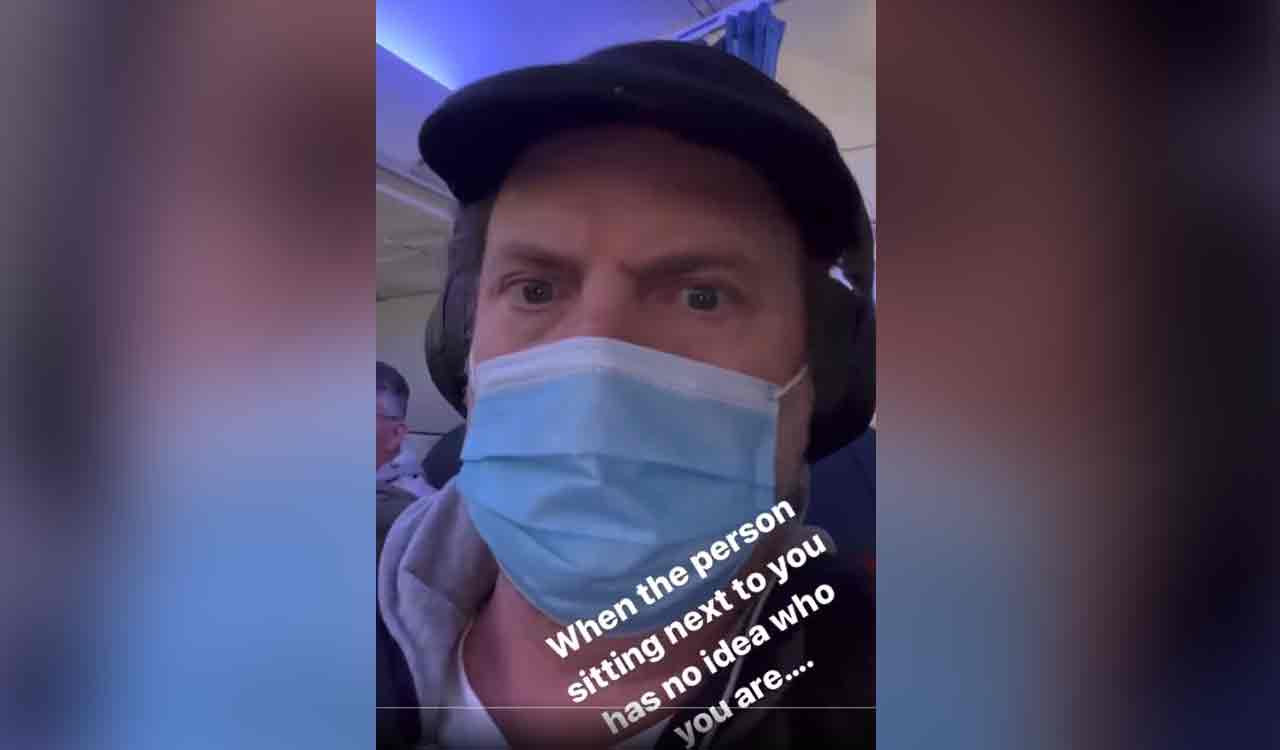 Watch: Man watches ‘The Office’ on flight with no idea Rainn Wilson is sitting next to him