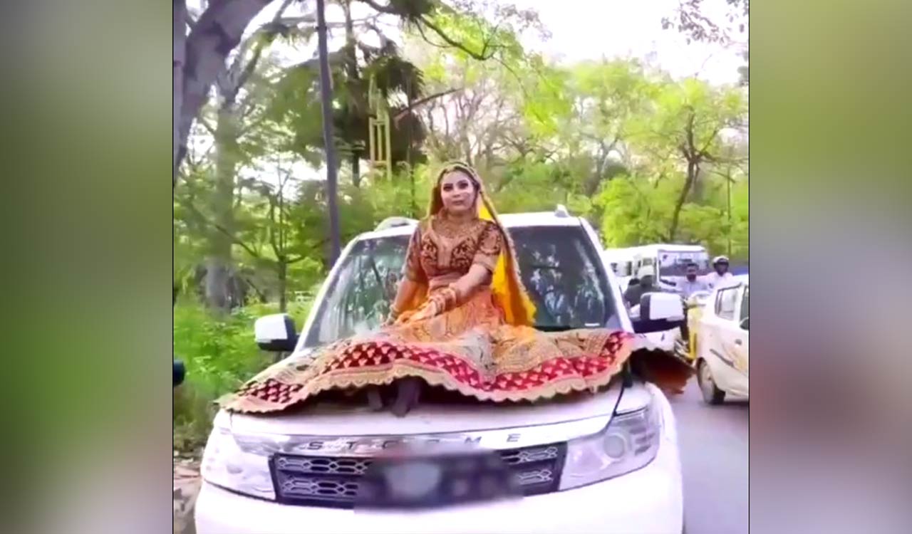 Bride rides on car bonnet, gets fined Rs 16,500 by cops